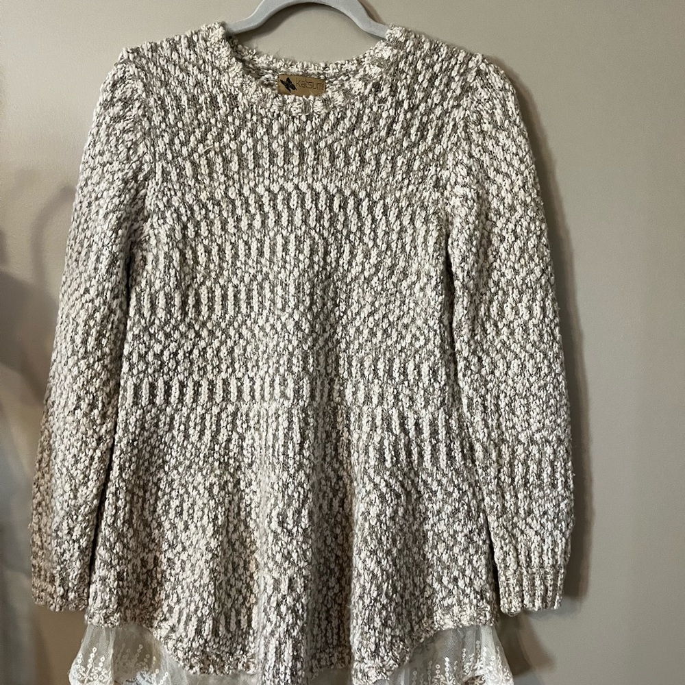 Beautiful beige sweater with lace bottom.